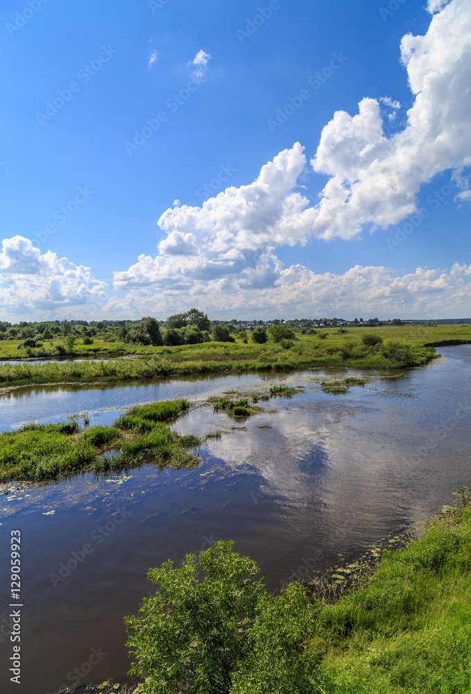 River outside the city on a windy summer day