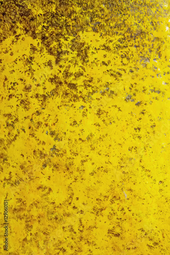 Yellow grunge textured wall. Copy space. abstract bright wallpap