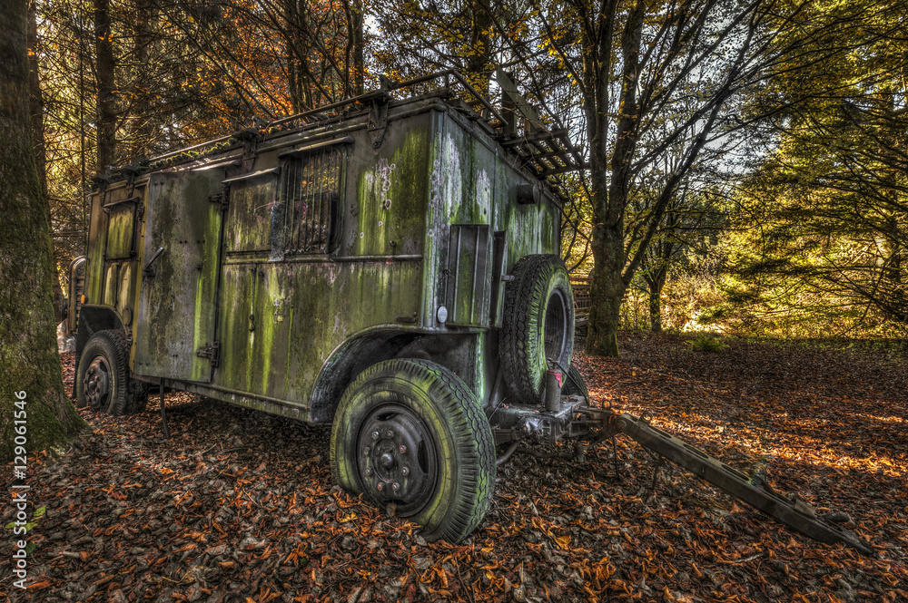 Abandoned military trailer in a forest