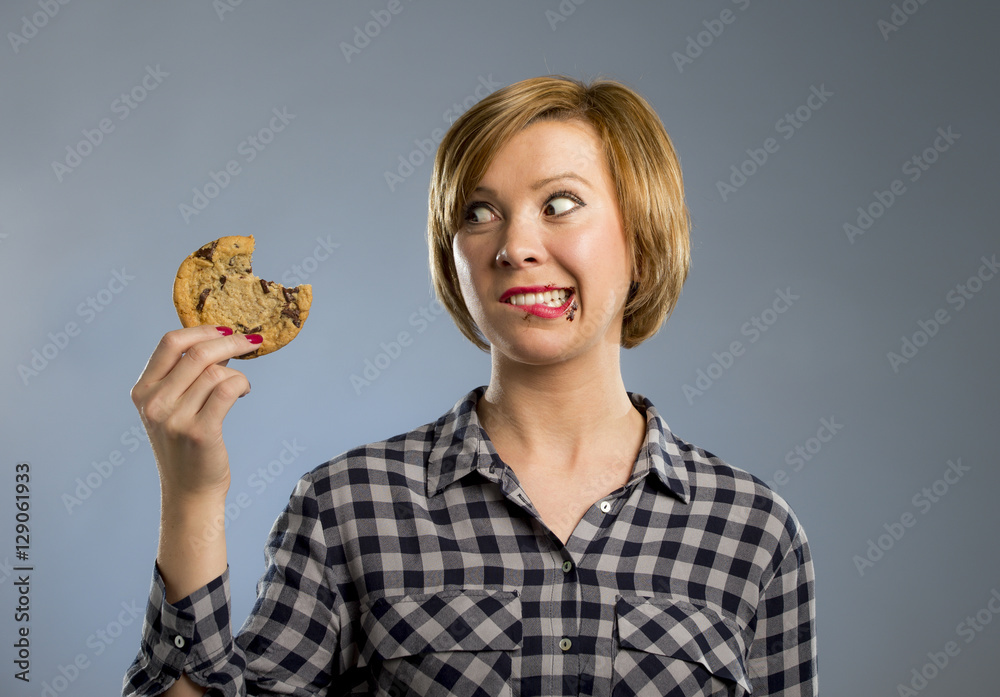 cute beautiful woman with chocolate stain in mouth eating big delicious cookie cute beautiful woman with chocolate stain in mouth eating big delicious cookie