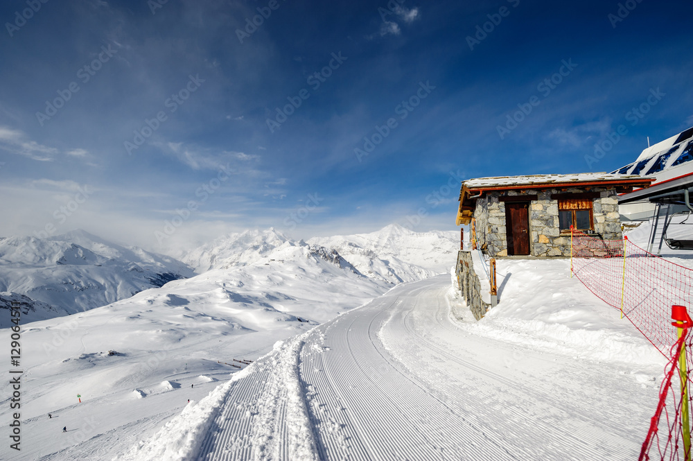 Fototapeta premium Alpine winter mountain landscape. French Alps with snow.