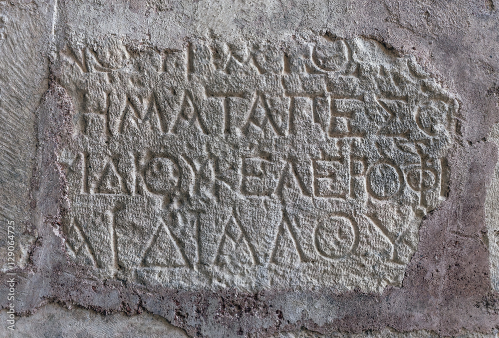 Antique writing,hieroglyph on the wall in Church of St. Nicholas in Demre in Turkey.
