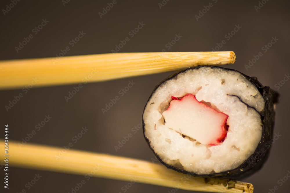 Pieces of sushi on a black stone