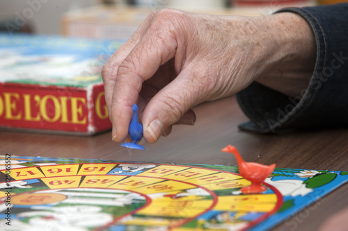 Playing goose board. Game of the goose. Retired. Elderly care. Daytime activities in care home. Netherlands.