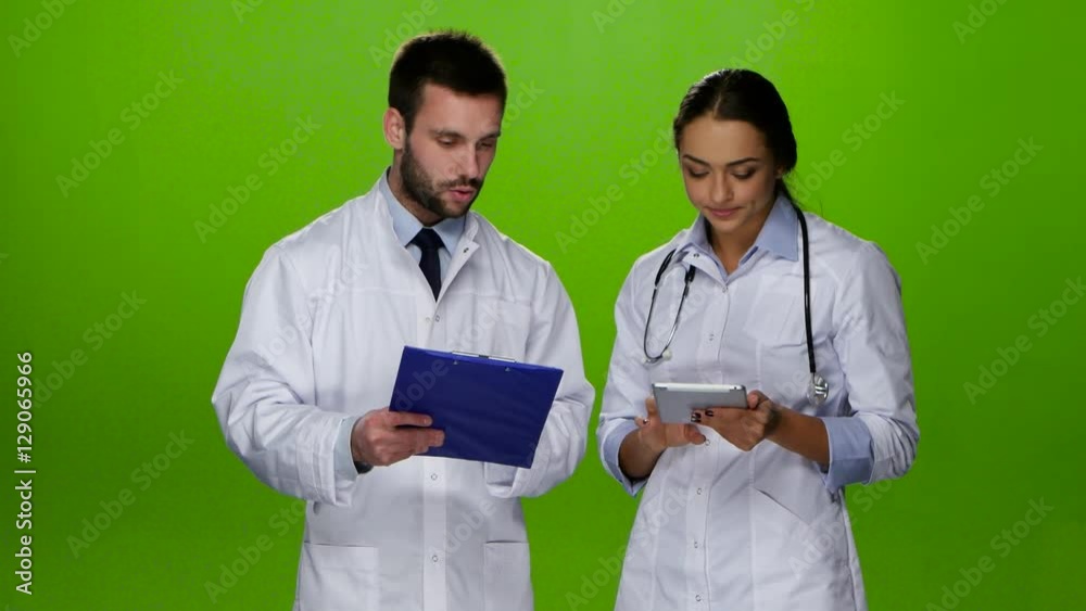 Paramedics discuss diagnosis of the patient. Green screen