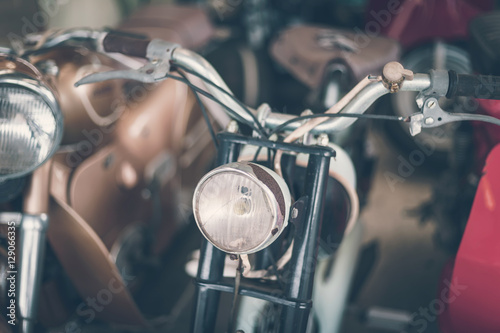 Close up headlight of old rusty vintage motorcycle