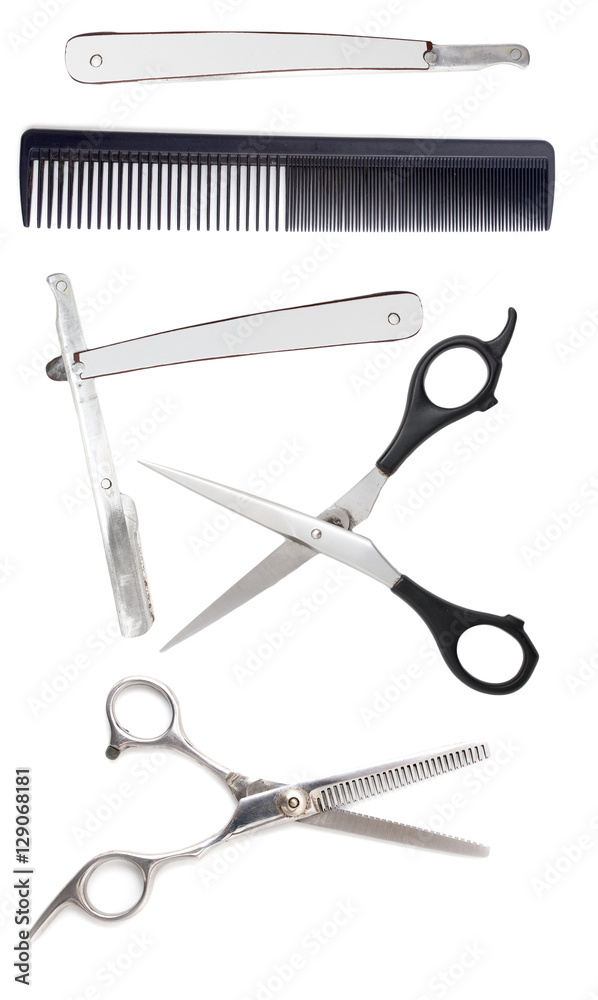 Comb with scissors and razor on a white background Comb with scissors and razor on a white background