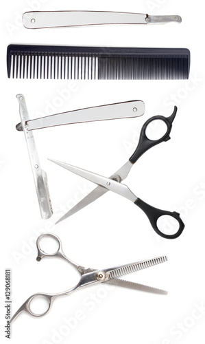 Comb with scissors and razor on a white background