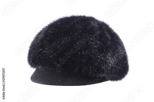 Women's fur hat with a visor is isolated on white