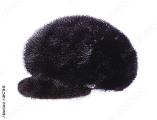 Women's fur hat with a visor is isolated on white © vitaly tiagunov