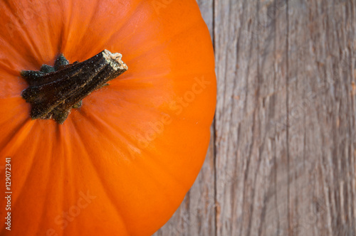 Pumpkin on wooden background photo