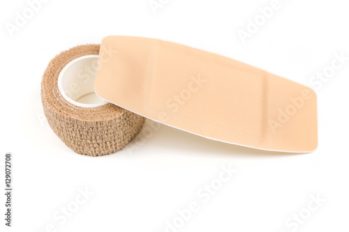 Large sticky bandage and bandage wrap isolated on white background