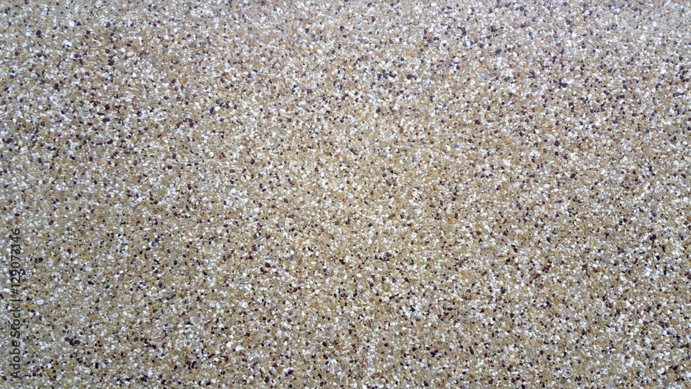 Surface of pebbles on sidewalk Surface of pebbles on sidewalk