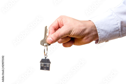 hand holding house keys on white background