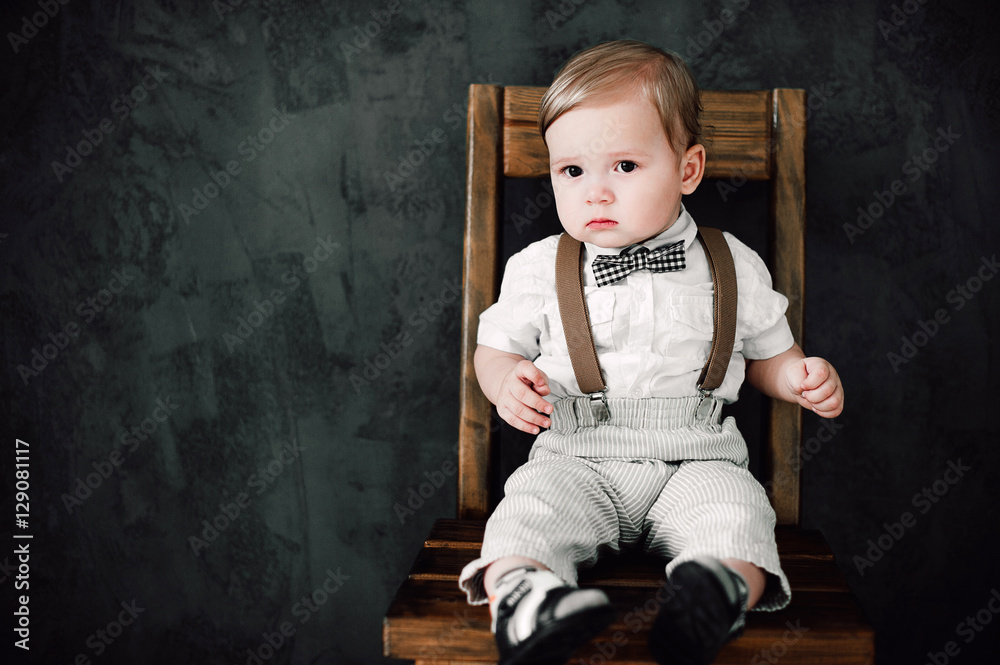 Fototapeta premium two babies wedding - boy dressed as groom, little gentleman dressed in bow-tie