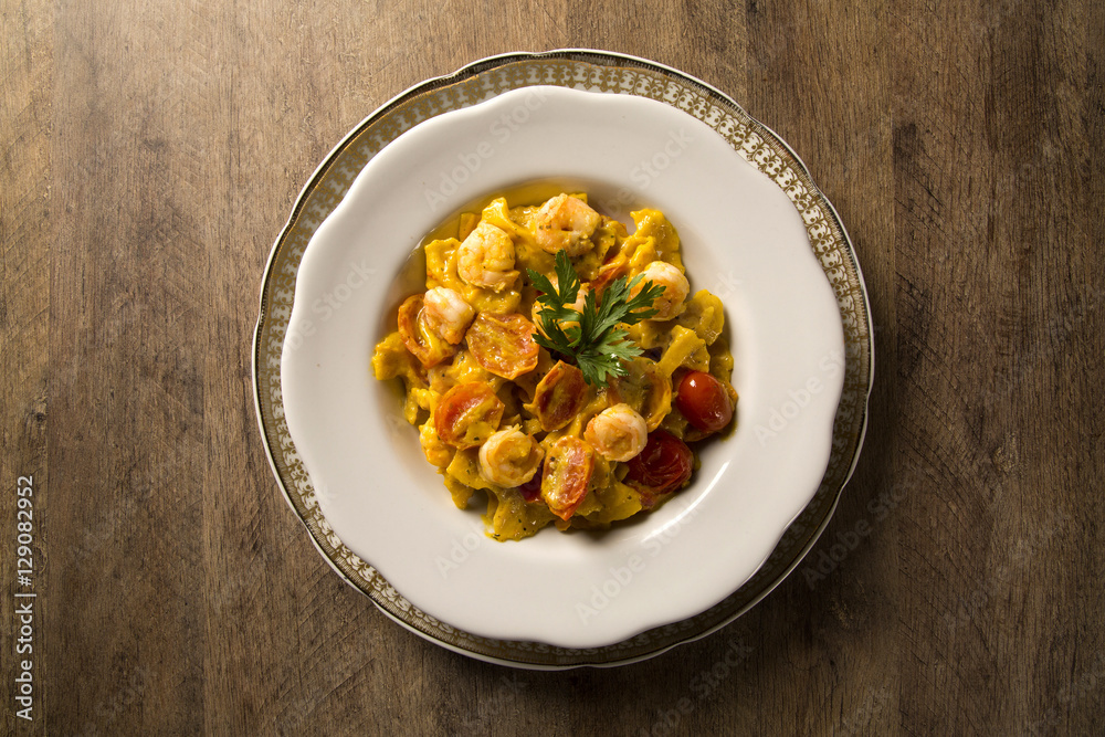 Pumpkin farfalle with shrimp and cherry tomato