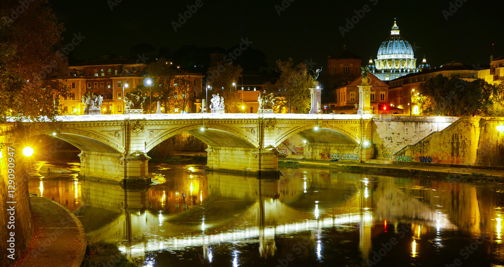 The Bridges over River Tiber and St Peters Basilica in Rome by night