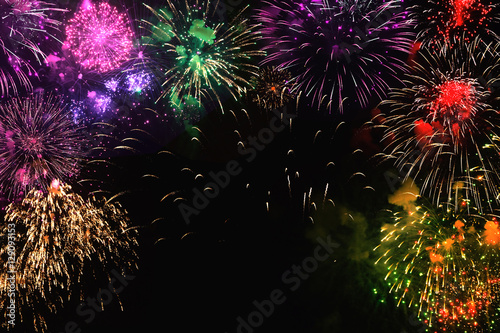 Greeting card with colorful fireworks on black background