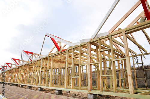 The wooden structure of the building. Wooden frame building. Connection and fastening of beams in the construction of buildings. Roofing Construction. Wooden Roof Frame House Construction.