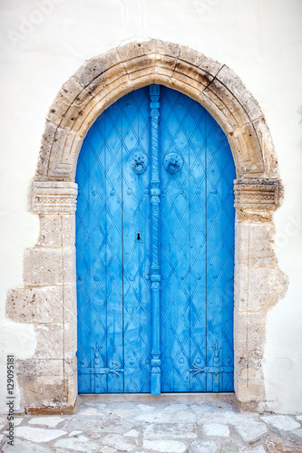 Close up of an old wooden blue door. © Dmytro Panchenko