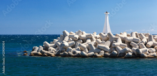 Small lighthouse  in Zygi Marina. Cyprus. photo