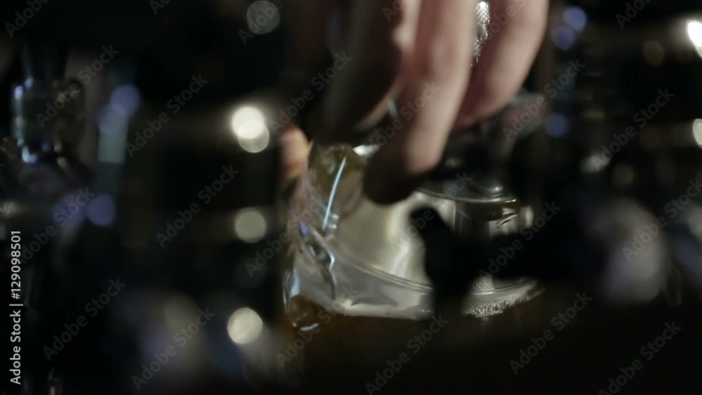 Pouring Pint of Beer. Lager at Bar Pouring Pint of Beer. Lager at Bar