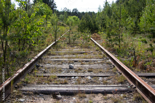 Old rusty railway tracks with wooden sleepers