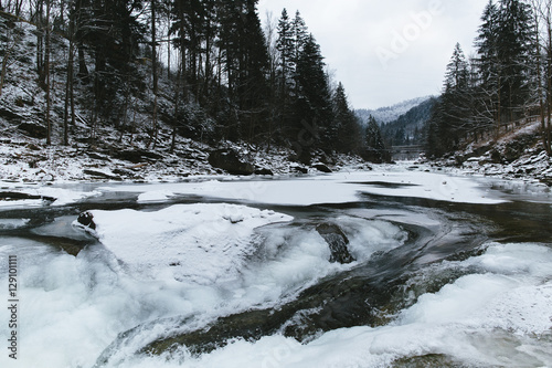 Winter river in mountains.