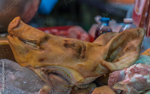 Pigs head in Thai Market. © johnandpenny