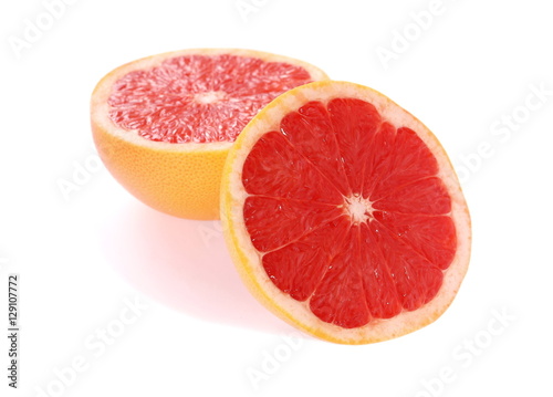 Half and slice of grapefruit isolated on white