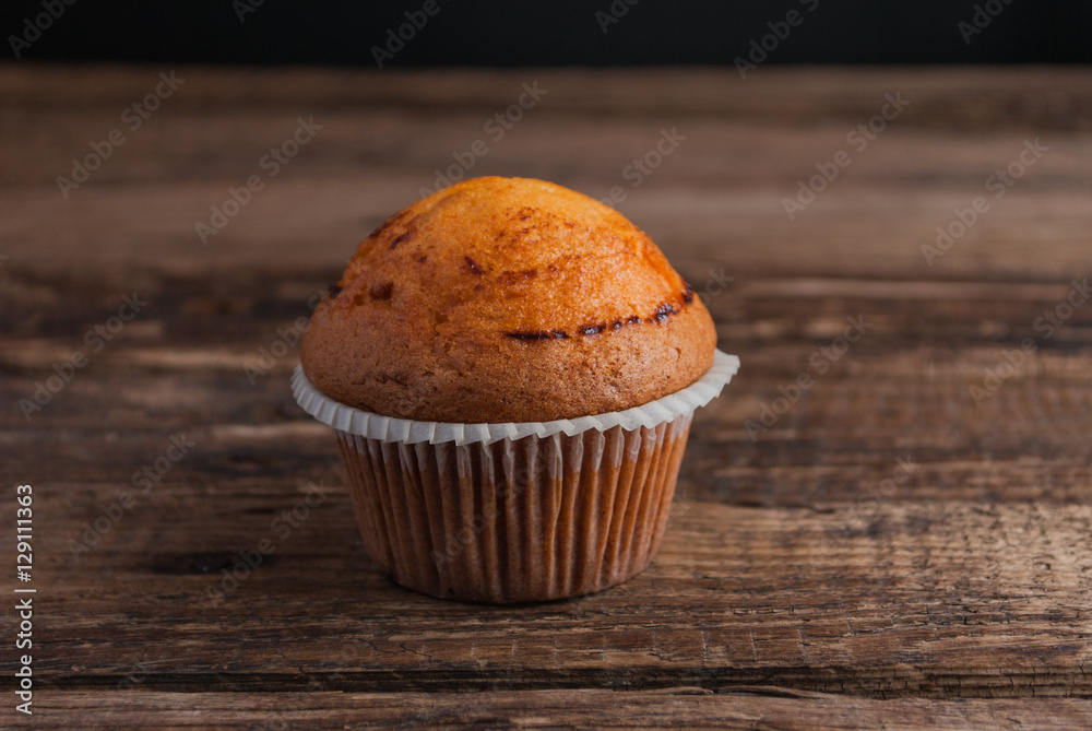 Cupcake on Wooden Background. Horizontal. Cupcake on Wooden Background. Horizontal.