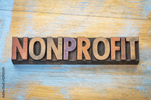 nonprofit word  in wood type photo