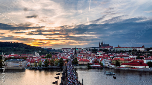 Aerial view from the Bridge tower on Charles Bridge and Prague Castle at sunset, Czech Republic