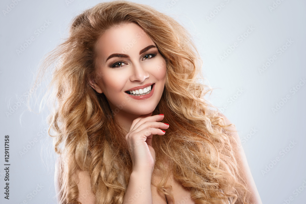 Portrait of beautiful blonde woman with curly hair Portrait of beautiful blonde woman with curly hair