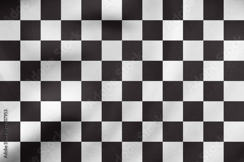 Checkered racing flag waving, real fabric texture