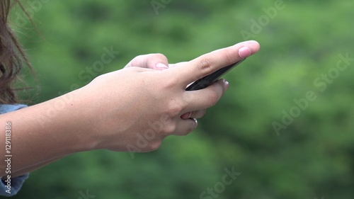 Girl Using Smart Phone Or Texting © dtiberio