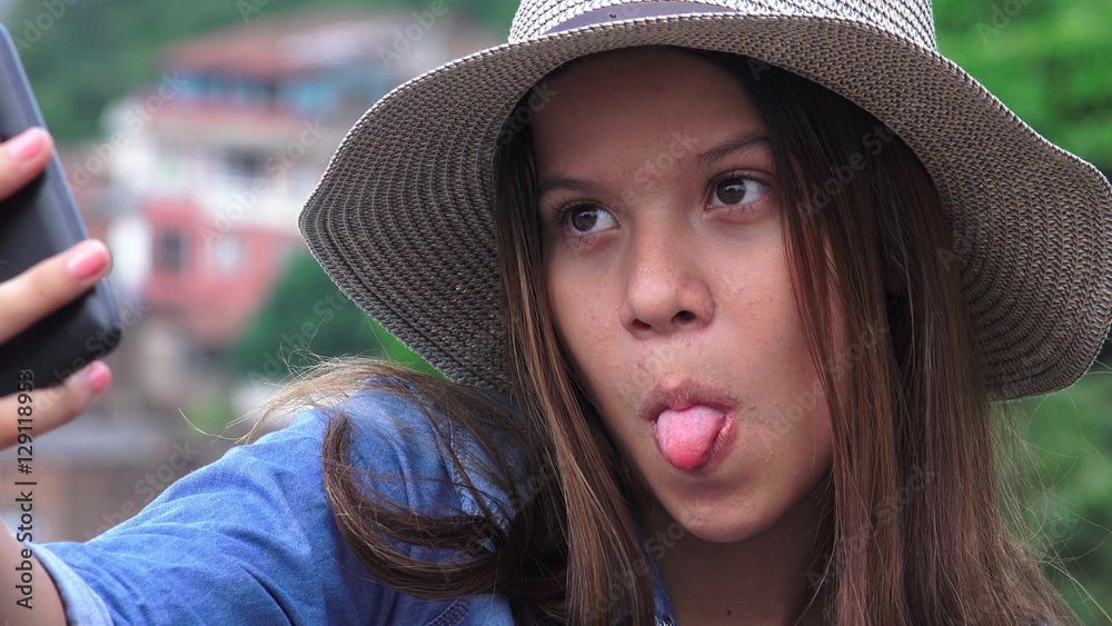 Teen Girl Making Goofy Funny Faces For Selfy