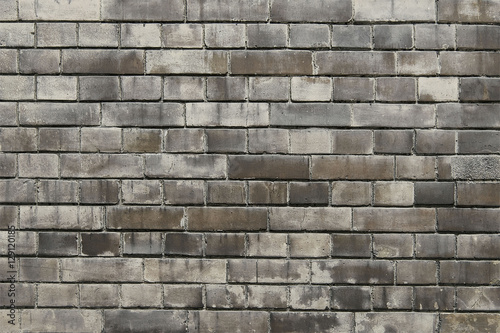 Old grey brick wall background texture