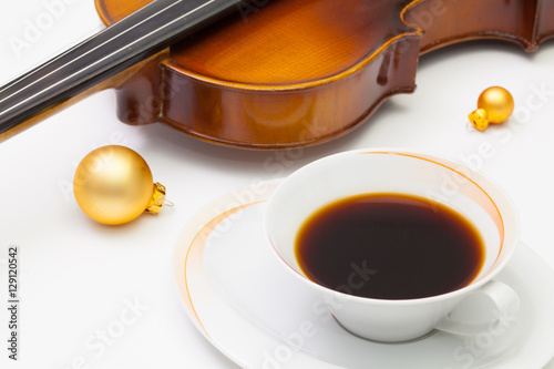 Canvas Print Cup of coffee, old violin and Christmas decoration on the white