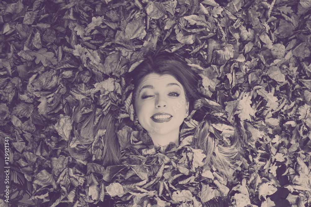 Young lady covered by leaves. Young lady covered by leaves.