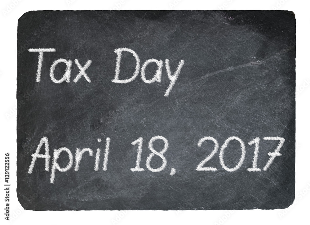 Fototapeta premium Tax Day concept using chalk on slate blackboard