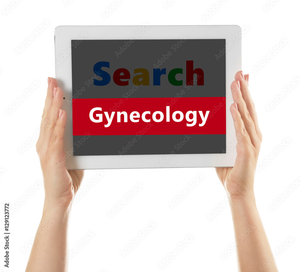 Female hands with tablet on white background. Word GYNECOLOGY at search engine. Health care concept. Female hands with tablet on white background. Word GYNECOLOGY at search engine. Health care concept.