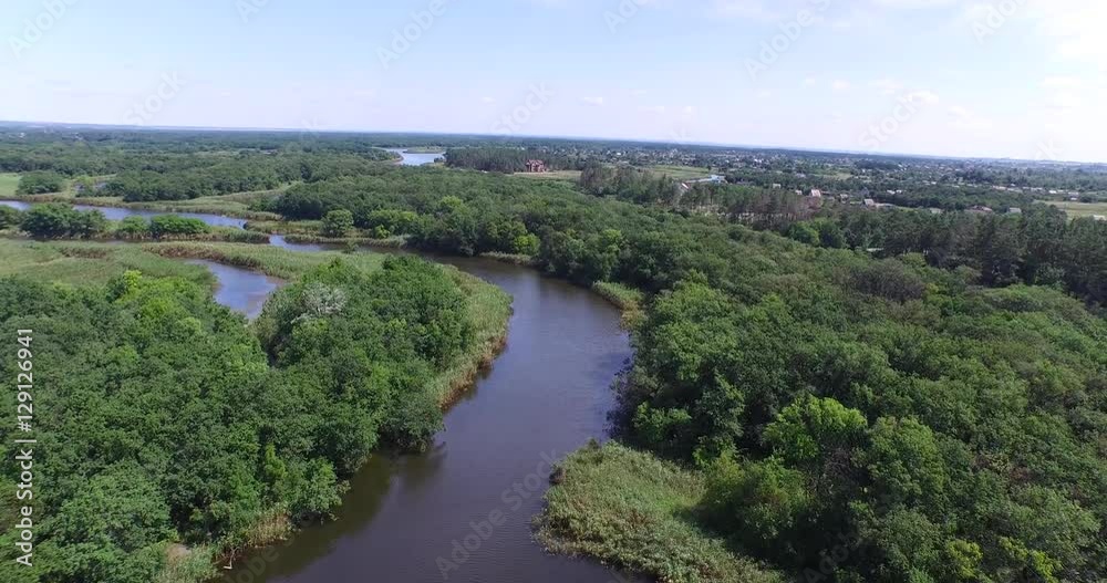 Flying over the forest and the river with lots influx Flying over the forest and the river with lots influx