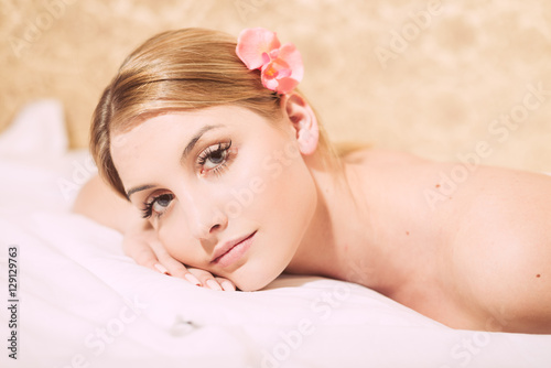 Portrait pretty woman during spa massage procedures in salon