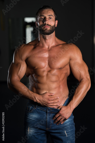 Muscle Man Posing In Gym