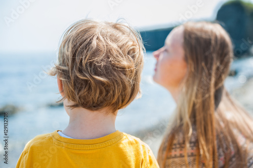 Boy looks at the sea photo