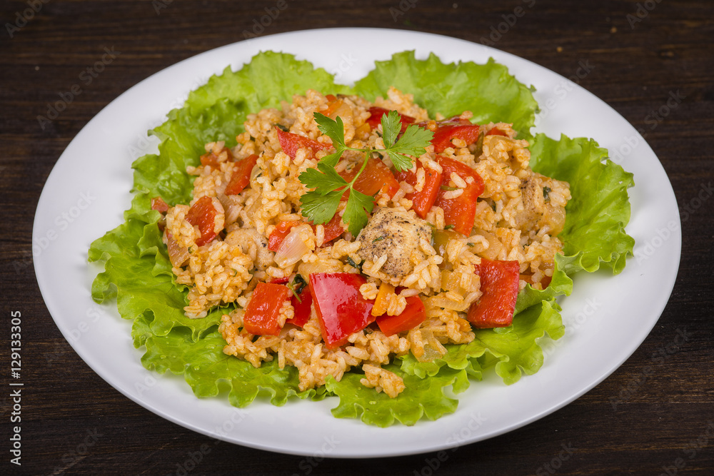 Rice with vegetables and chicken in a curry sauce. Rice with vegetables and chicken in a curry sauce.