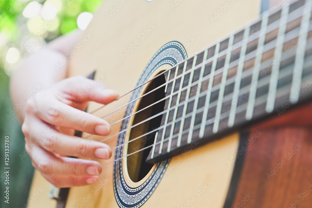 Fototapeta premium playing acoustic guitar