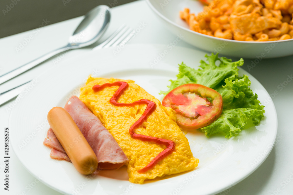 Breakfast of omelette with tomatoes and vegetable on dish. Breakfast of omelette with tomatoes and vegetable on dish.