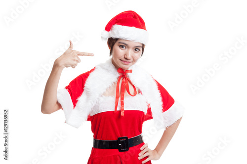 Asian Christmas Santa Claus girl point to blank space.
